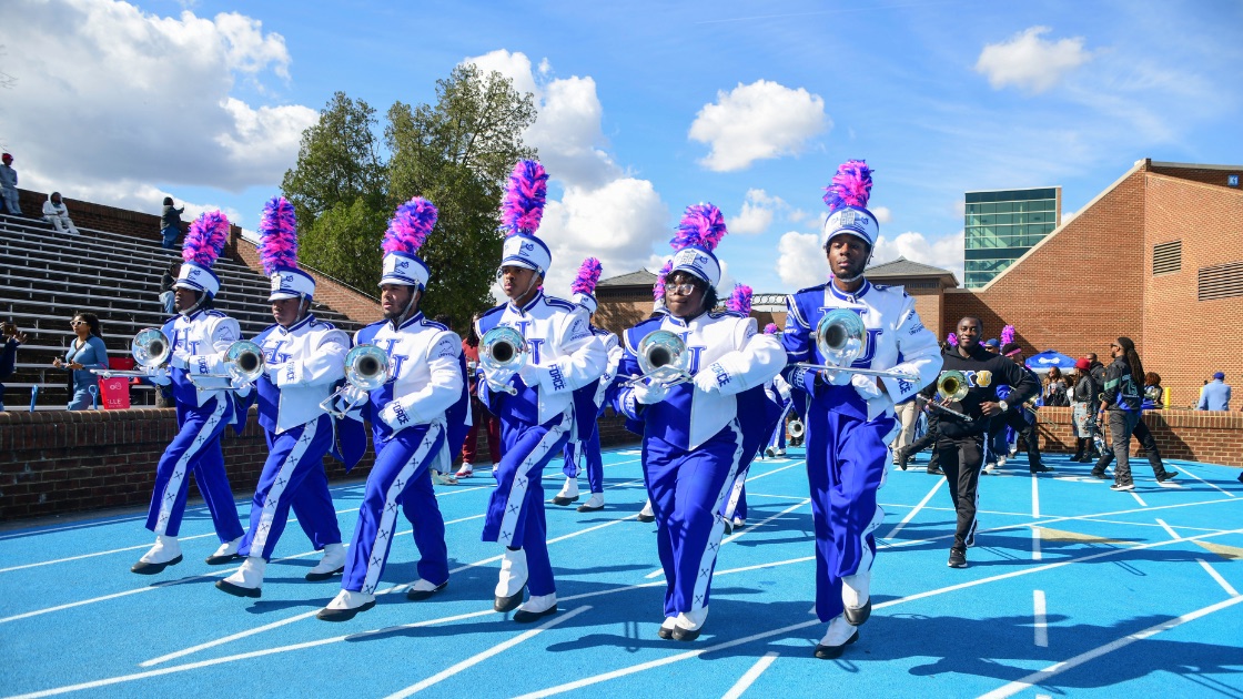 Hampton University's Marching Force performing in blue and white uniforms